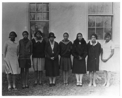 Miss Artemisia Bowden, headmistress, and girls from St Philip's School San Antonio