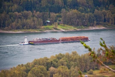 small tugboat pushing the barge