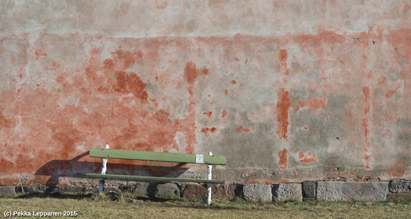 Bench for smokers against a wall