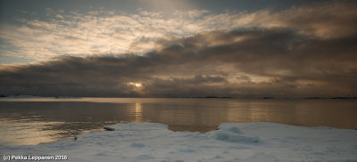 Noon sun (behind the clouds traising from the warm sea)