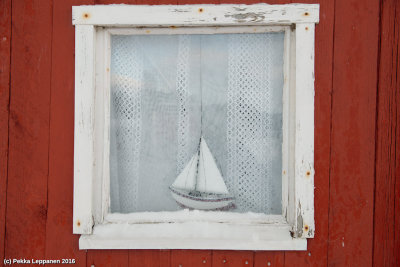 January sailing / Sailing boat in Fisherman's hut's window