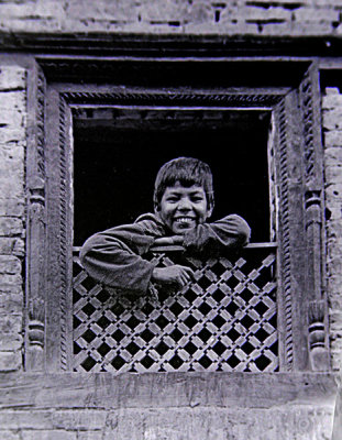 Nepali boy in window