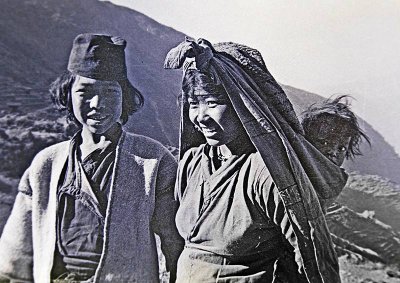 A very young Nepali couple and curious baby