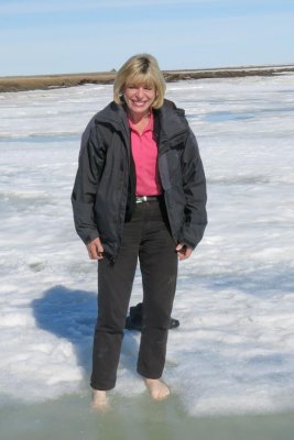 Ginny dips her toes in the Arctic Sea