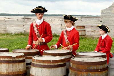 Drummers practicing on barrel heads