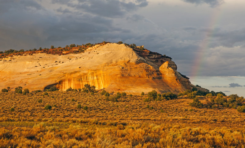 Cliff of Navajo Sandstone and rainbow, White Pocket, Vermilion Cliffs National Monument, AZ