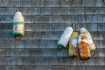 Bouys on the wall of a fishing shack, Peggys Cove, Nova Scotia