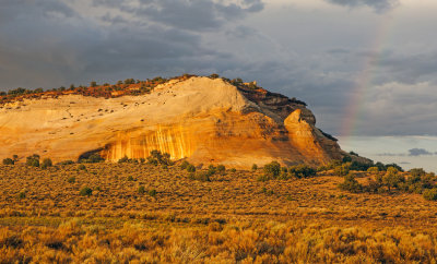 Cliff of Navajo Sandstone and rainbow, White Pocket, Vermilion Cliffs National Monument, AZ