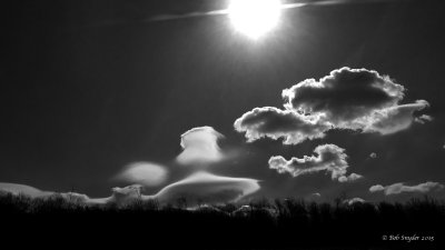 Lenticular clouds and mid-morning sun over an Appalachian ridge
