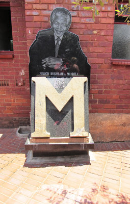  Mounted Photograph of Mandela at the rear Wall of his House