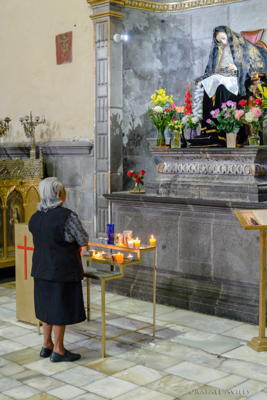 Praying to the Virgin Mary in the Iglesia de Santo Domingo, Puebla.