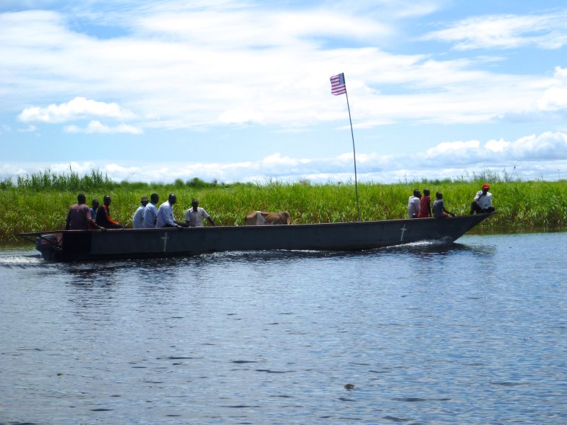 River barge with an American flag, the Sudd, South Sudan, Africa
