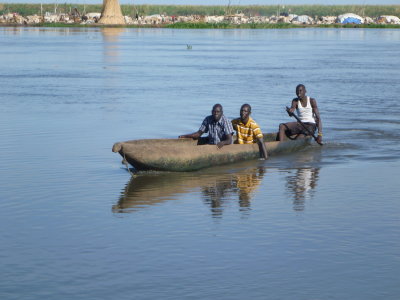 Crossing the White Nile in a dugout canoe.