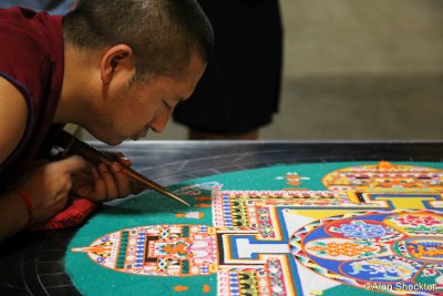 Drepong Loseling monk working on the mandala