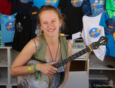 Volunteer Sasha playing from the Info Booth