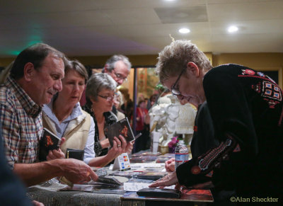 Eliza Gilkyson, noy signing autographs, but taking suggestions for an all-request second set