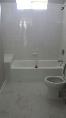 43. Front bathroom, new floor tile, OLD TUB