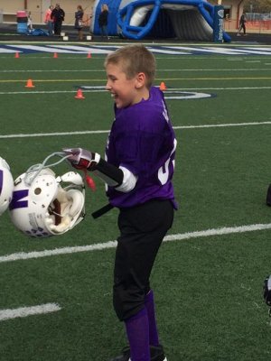 toasting his buddy with his helmet after their superbowl win!