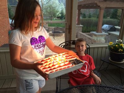 sister delivers the cake