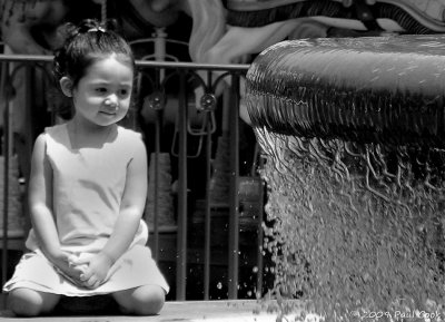 Little girl and fountain