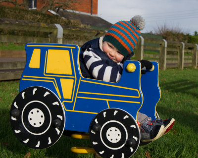 Henry driving a tractor