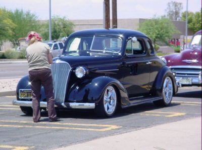 Kay inspecting the 1937 Chevy Coupe