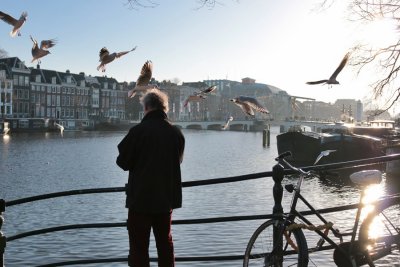 Feeding the Pigeons in the Binnen Amstel (Amstel River)