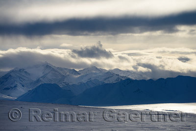 Clouds and blowing snow in the Brooks Range mountains Alaska from the Dalton Highway