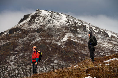 Two hikers descending to Wiseman Creek valley in the Endicott Range Mountains Alaska