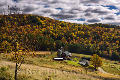 Hillside Acres farm Barnet Center Vermont with Fall colors and clouds