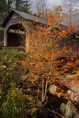 Sunny break on Pine Brook Covered Bridge Waitsfield Vermont in the Fall 