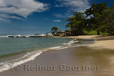 Wide sand beach and shanty gift shops in Maimon Bay Dominican Republic