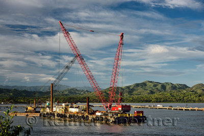 Crane barge constructing new cruise ship terminal in Maimon Bay Dominican Republic