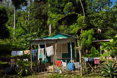 Rural house in Dominican Republic with washed clothes drying on the line