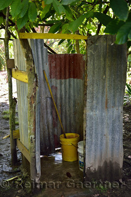 Simple outdoor latrine in yard of house in rural Dominican Republic