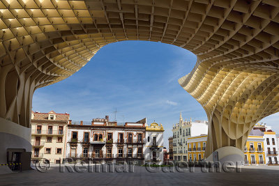 Canopy of Metropol Parasol framing buildings around Plaza of the Incarnation Seville Spain