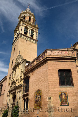 Bell tower of the Catholic church of Saint Peter at Plaza de san Pedro in Seville Spain
