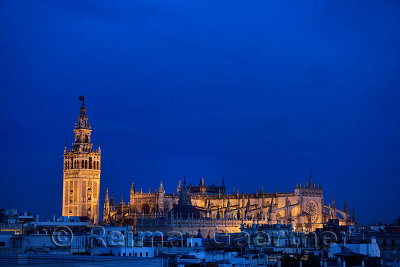 Saint Mary of the See largest cathedral in the world in Seville Spain at dusk with lights