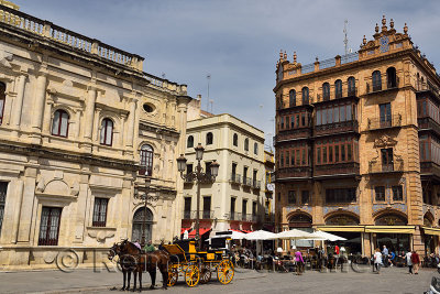 Horse drawn carriage beside City Hall in Plaza de San Francisco Seville Spain