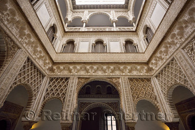 Ornate plasterwork in Courtyard of the Dolls at the Royal Palace Alcazar Seville Andalusia
