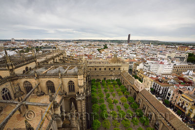 View west from Giralda tower Seville cathedral roof and orange tree courtyard