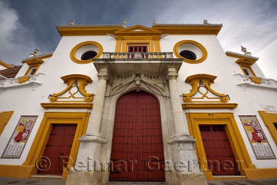 Front doors and baroque facade of the Plaza de Toros Bull fighting ring in Seville Spain