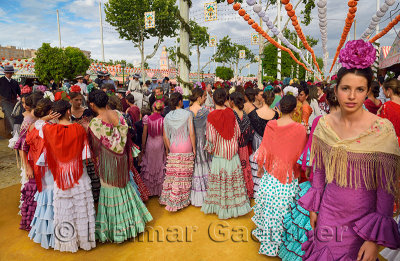 Group of young female students dressed in flamenco dresses at the April Fair in Seville