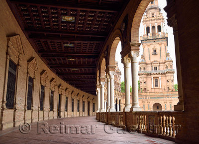 South Tower with curved roofed walkway with pillars at Plaza de Espana Seville Spain