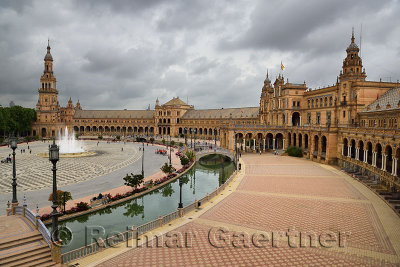 North tower and Main building with canal and bridges at Plaza de Espana Seville