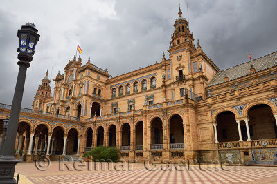 Empty square and dark clouds at the Main Building of Plaza de Espana Seville Spain