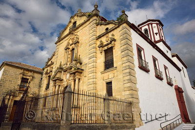 Baroque architecture and bell tower of Saint Cecilia Catholic Church in Ronda Spain