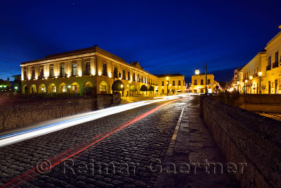 Car head and tail light trails at twilight on the Puente Nuevo bridge and Plaza Espana in Ronda Spain