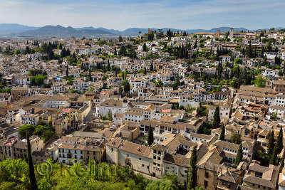 View of Albaicin with Churches and tile rooftops from Alcazaba fortress in Granada Spain