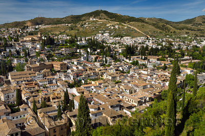 View of Albaicin with ancient wall from Alcazaba fortress Alhambra in Granada Spain